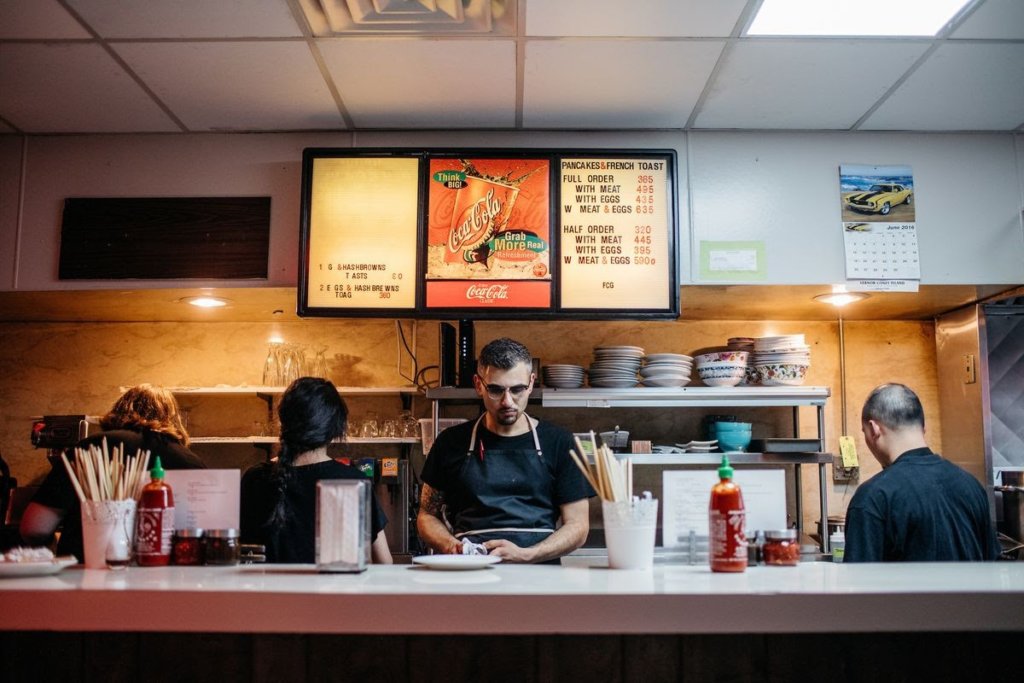 Detroit Chef George Azar preps for a busy night of service at the counter of his restaurant, Flowers of Vietnam